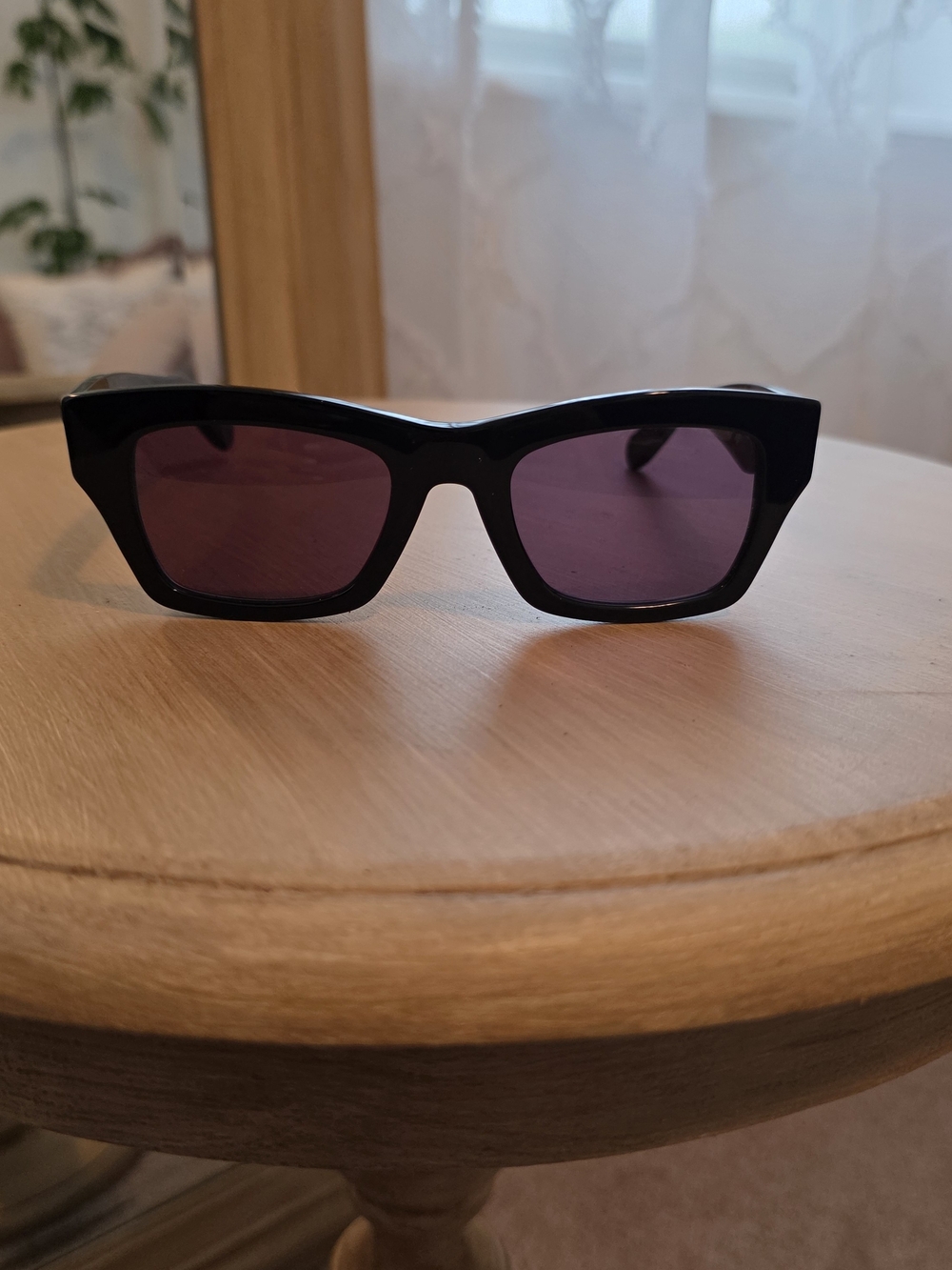 Salvatore Ferragamo Black Frame Sunglasses with Purple Lenses
